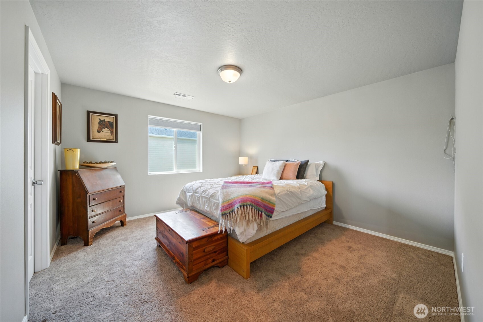 1382 Caprio Loop Walla Walla, WA 99362 - Photo 21 of 36 a spacious bedroom with a bed and a window