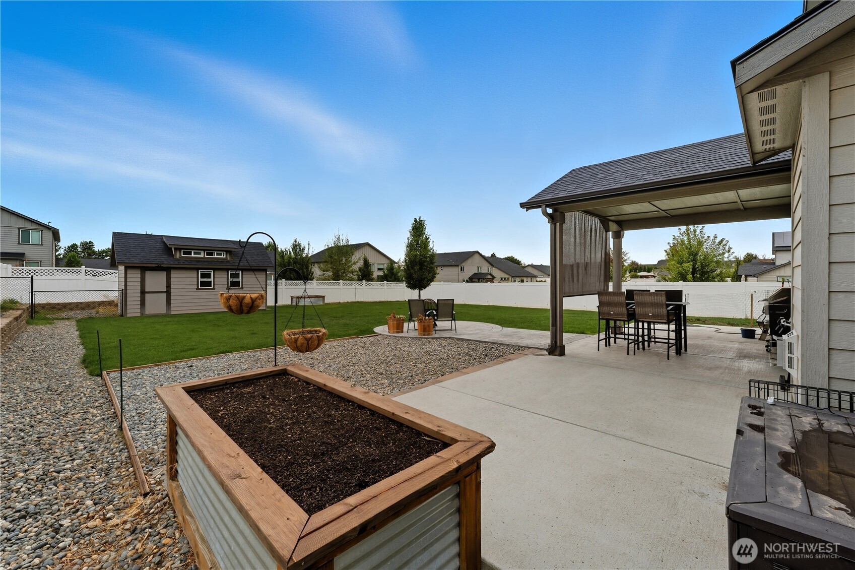 1382 Caprio Loop Walla Walla, WA 99362 - Photo 28 of 36 a view of a backyard with sitting area