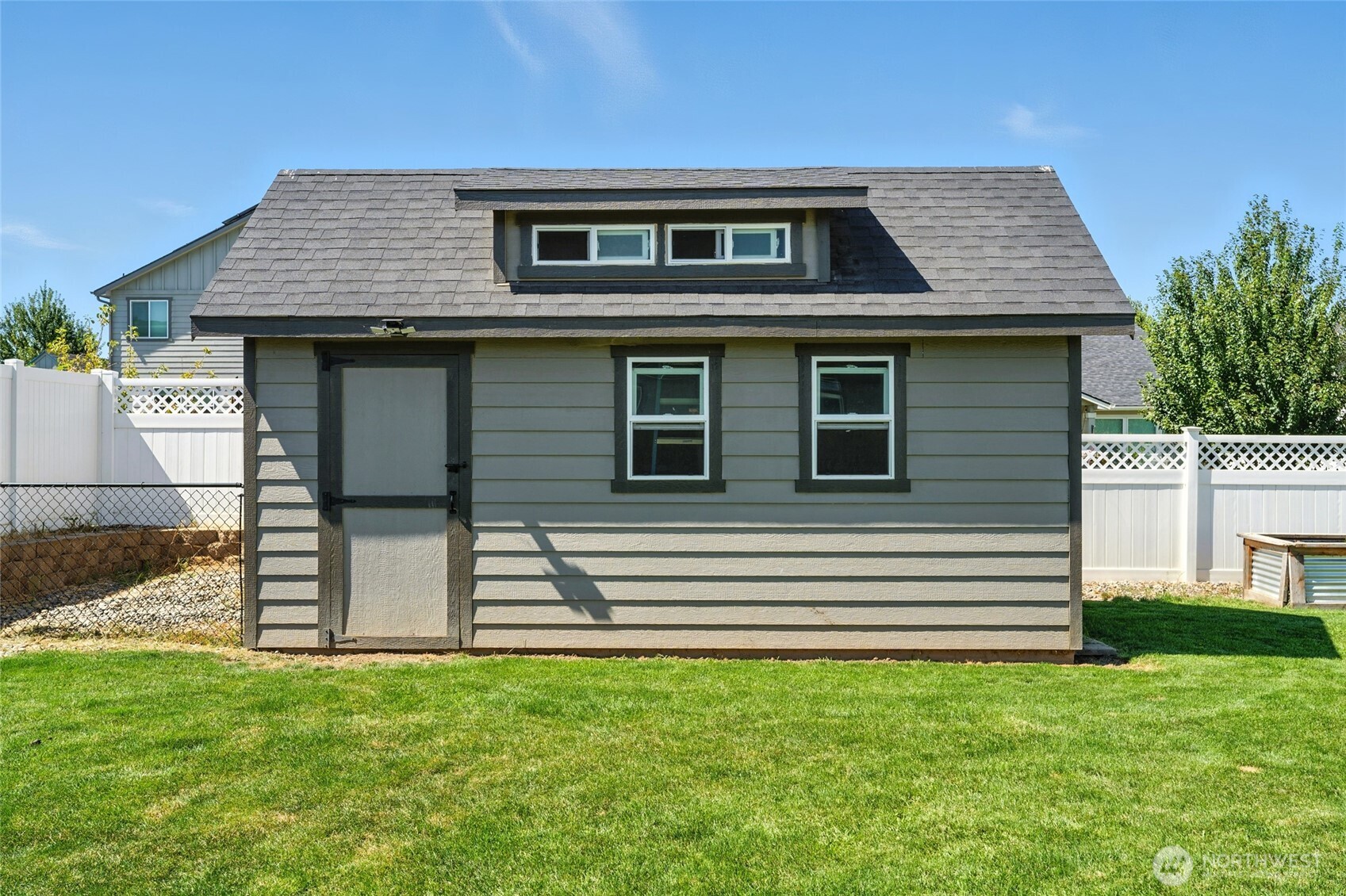 1382 Caprio Loop Walla Walla, WA 99362 - Photo 31 of 36 a front view of a house with a yard
