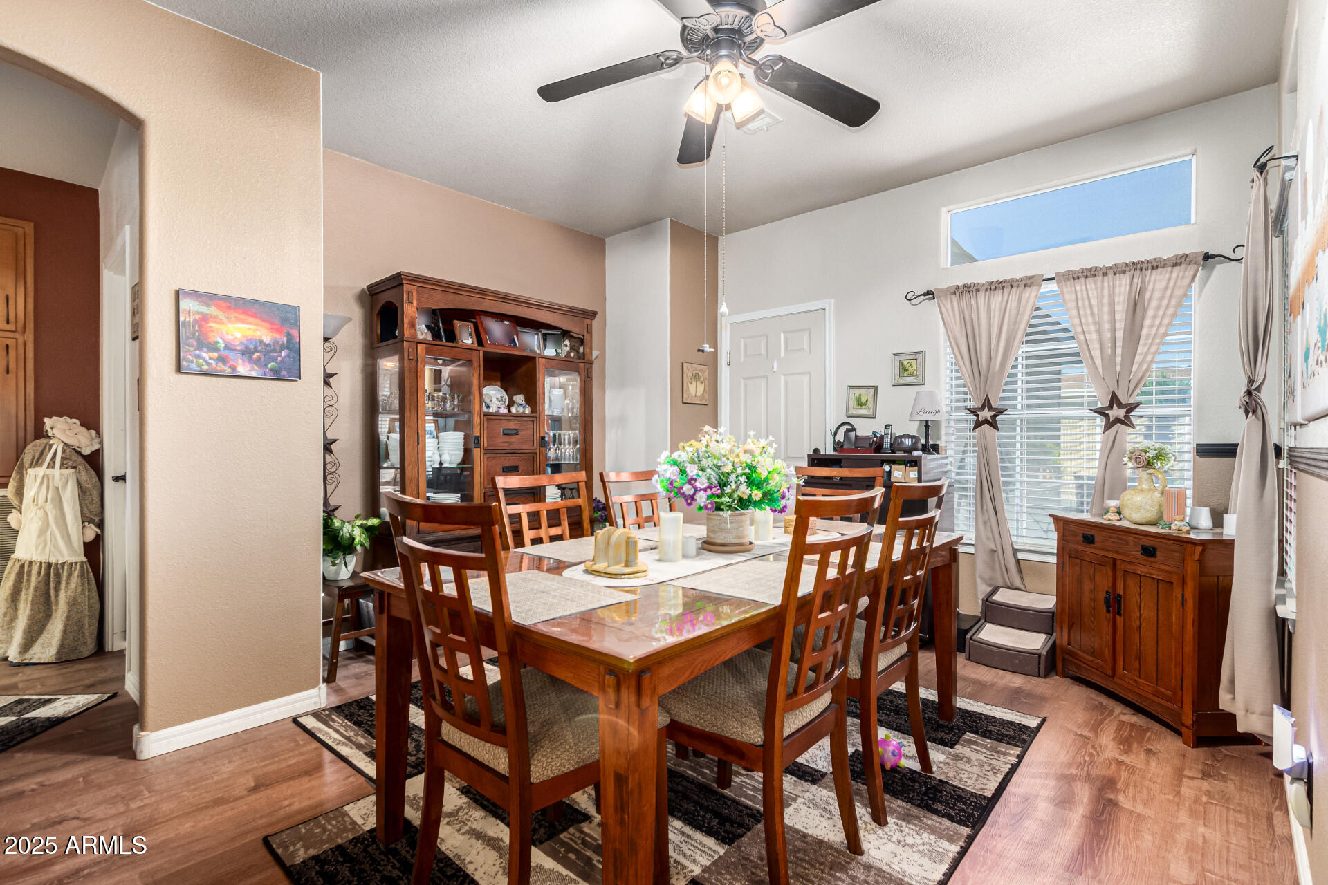 3301 South Goldfield Road, Unit 2090 Apache Junction, AZ 85119 - Photo 12 of 35 a view of a dining room with furniture and a chandelier