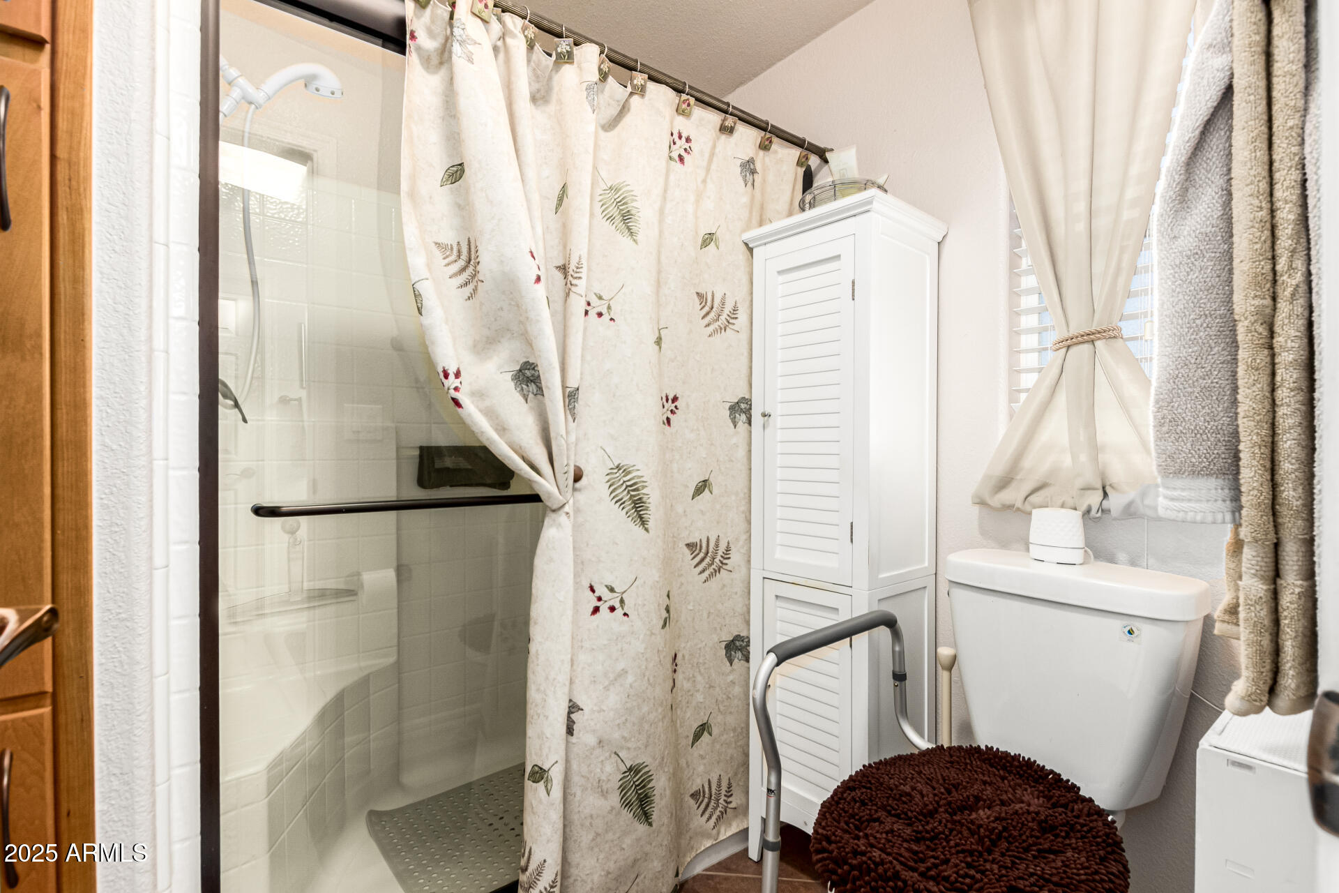 3301 South Goldfield Road, Unit 2090 Apache Junction, AZ 85119 - Photo 15 of 35 a bathroom with a sink a toilet and a shower
