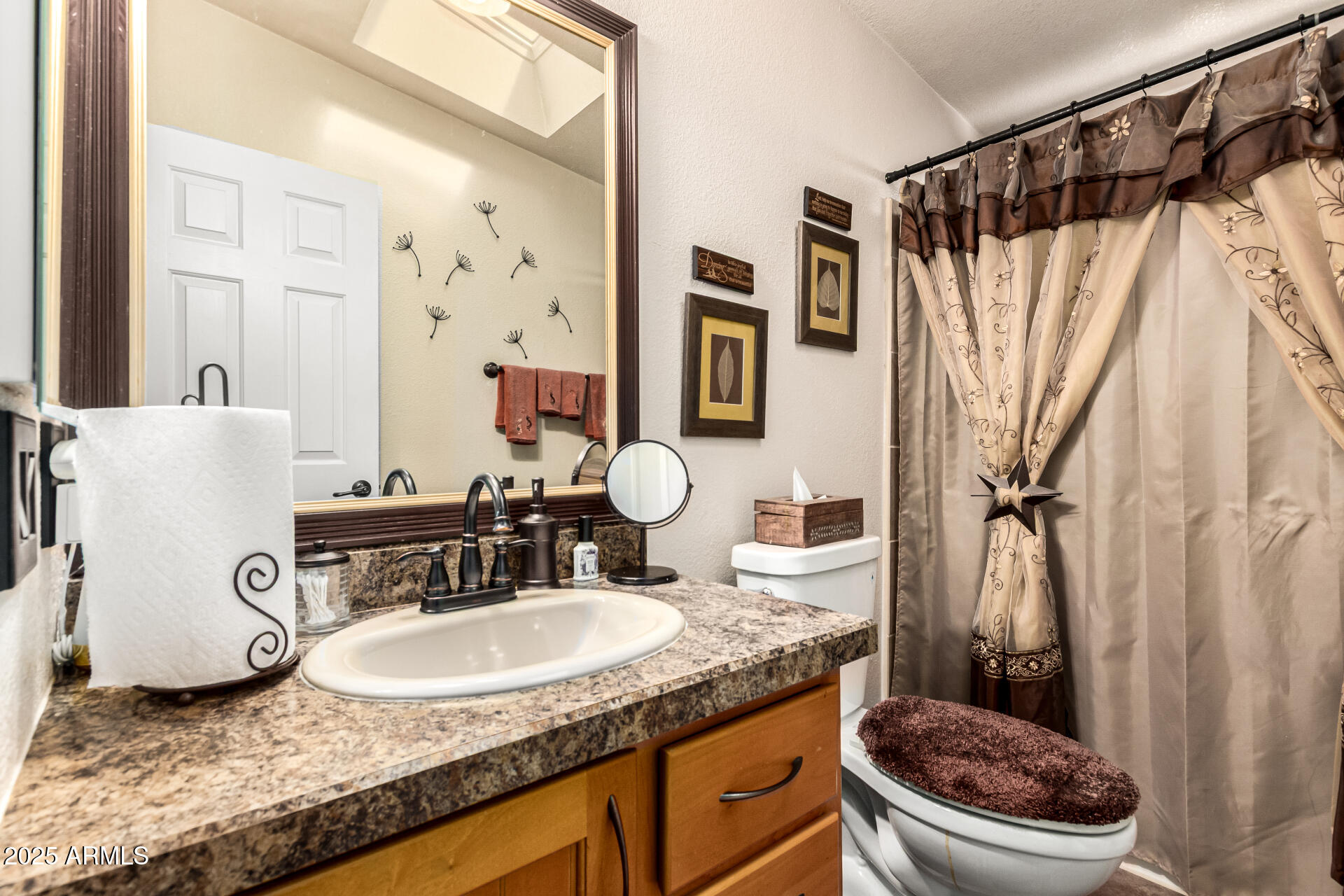 3301 South Goldfield Road, Unit 2090 Apache Junction, AZ 85119 - Photo 20 of 35 a bathroom with a granite countertop sink and a mirror