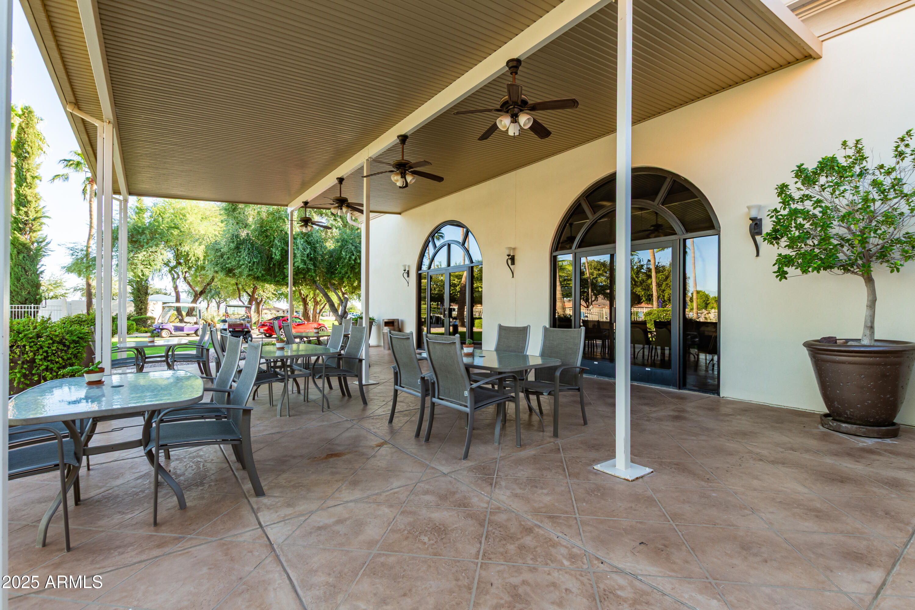 3301 South Goldfield Road, Unit 2090 Apache Junction, AZ 85119 - Photo 24 of 35 a view of a tables and chairs in a patio