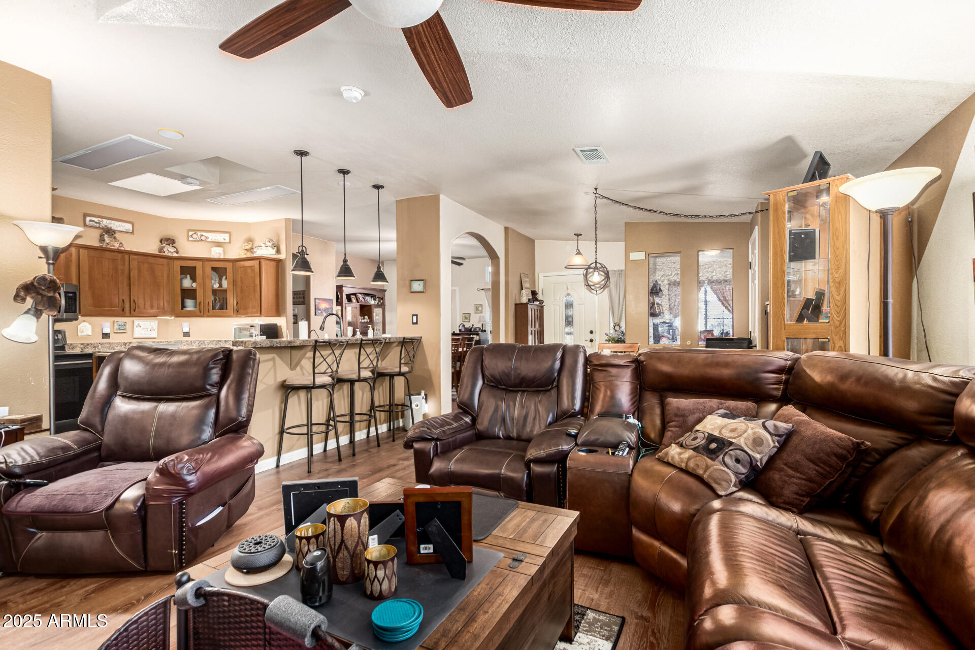 3301 South Goldfield Road, Unit 2090 Apache Junction, AZ 85119 - Photo 9 of 35 a living room with furniture kitchen view and a large window