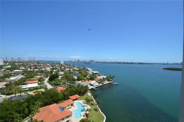 an aerial view of a house with a lake view