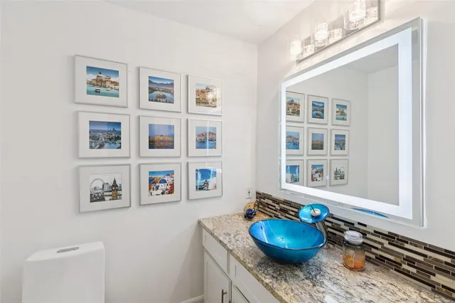 a living room with furniture and a chair