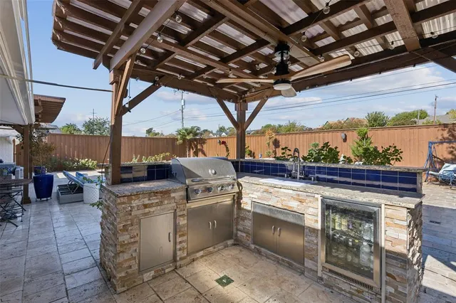 a view of a patio with a table and chairs