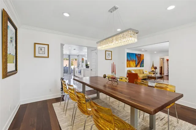 a room with dining table and chairs