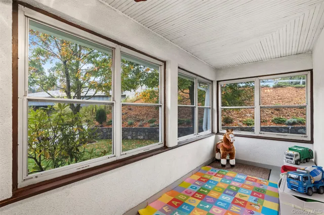 a room with toys and large windows