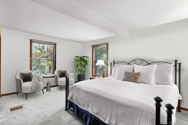 a bedroom with a large bed and a view of bedroom