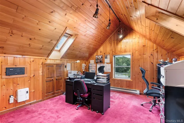 a view of a workspace with furniture