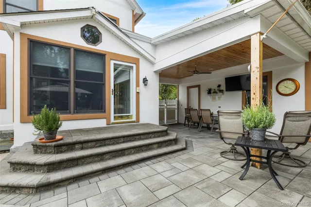 a view of house with outdoor seating space
