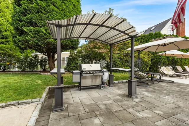 a house view with a sitting space and garden