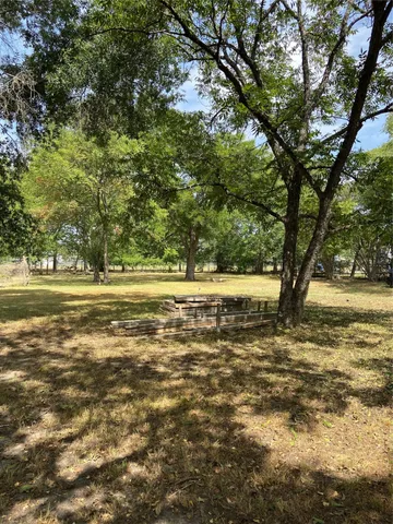 a view of outdoor space with deck and yard