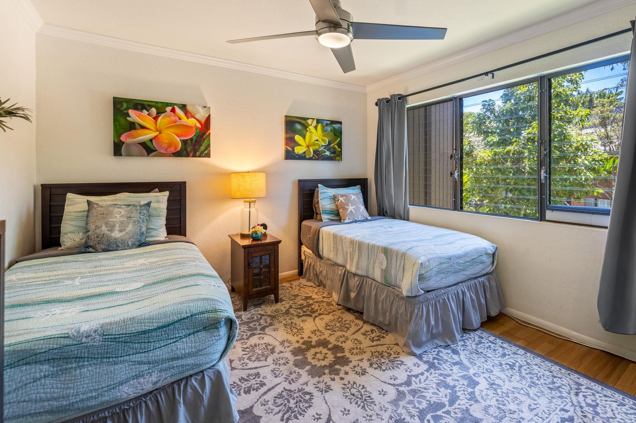 777 South Kihei Road, Unit 221G Kihei, HI 96753 - Photo 17 of 50 a bedroom with a bed and a large window