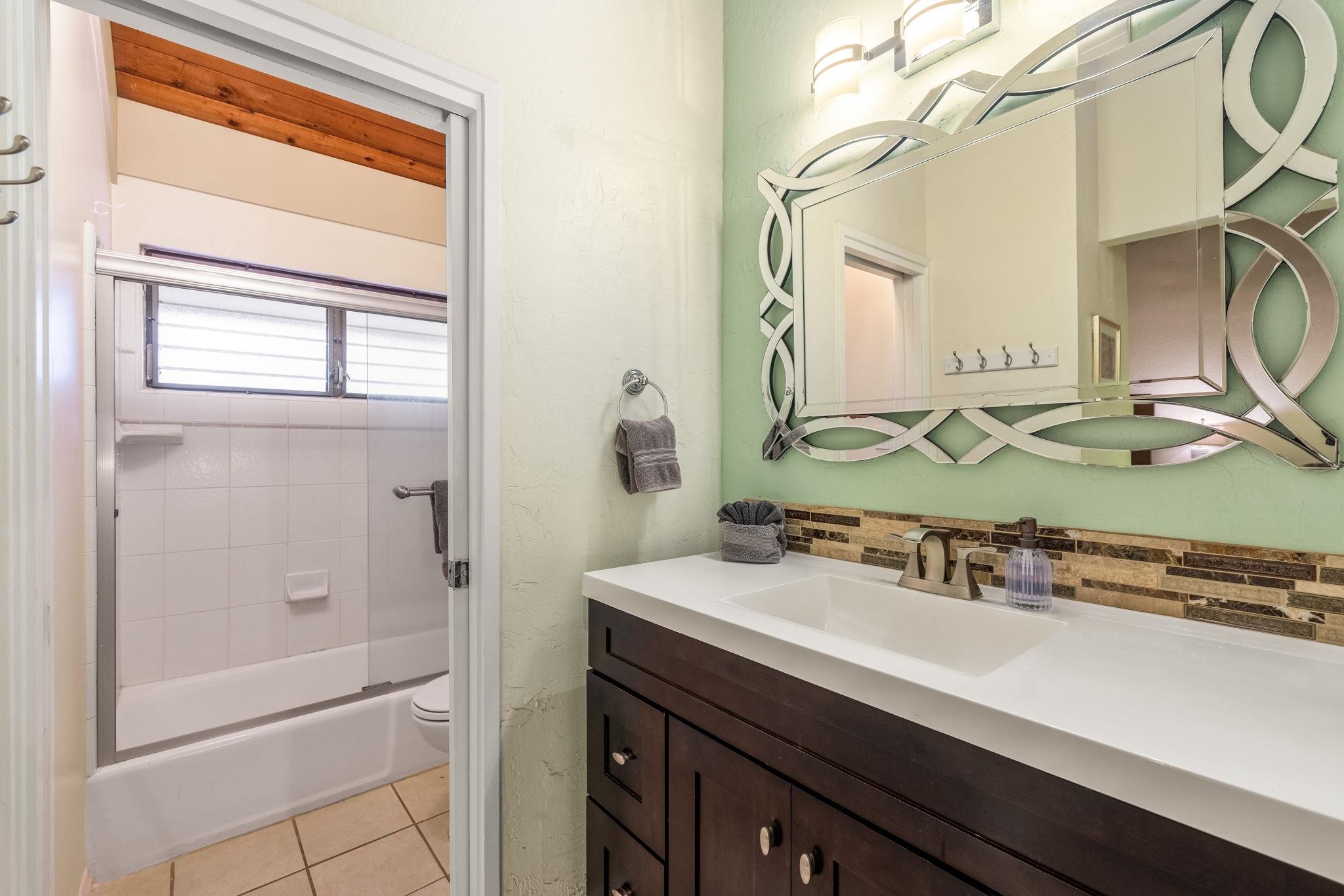 777 South Kihei Road, Unit 221G Kihei, HI 96753 - Photo 24 of 50 a bathroom with a sink and a mirror