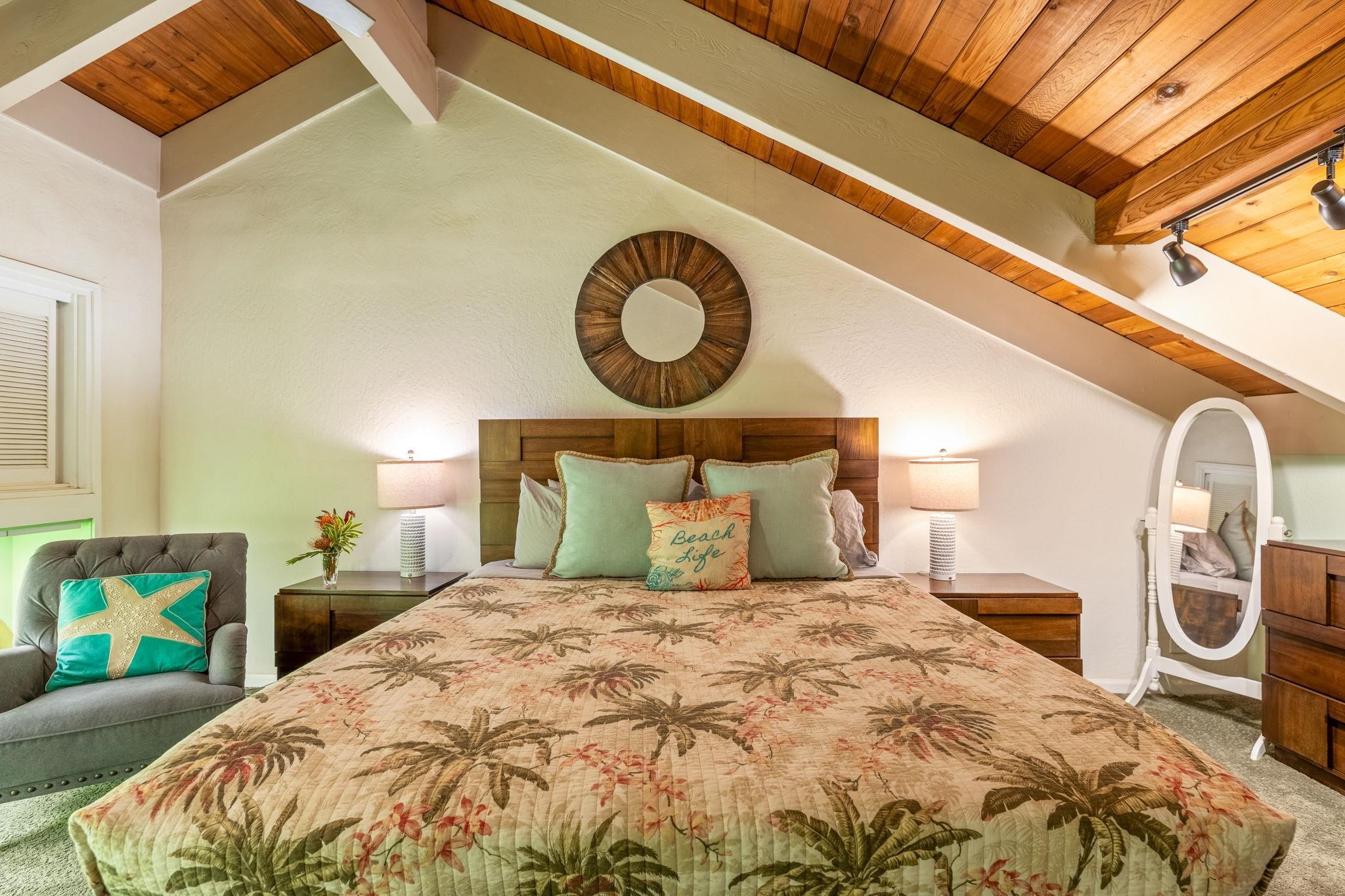 777 South Kihei Road, Unit 221G Kihei, HI 96753 - Photo 28 of 50 a bedroom with a bed and a painting on the wall