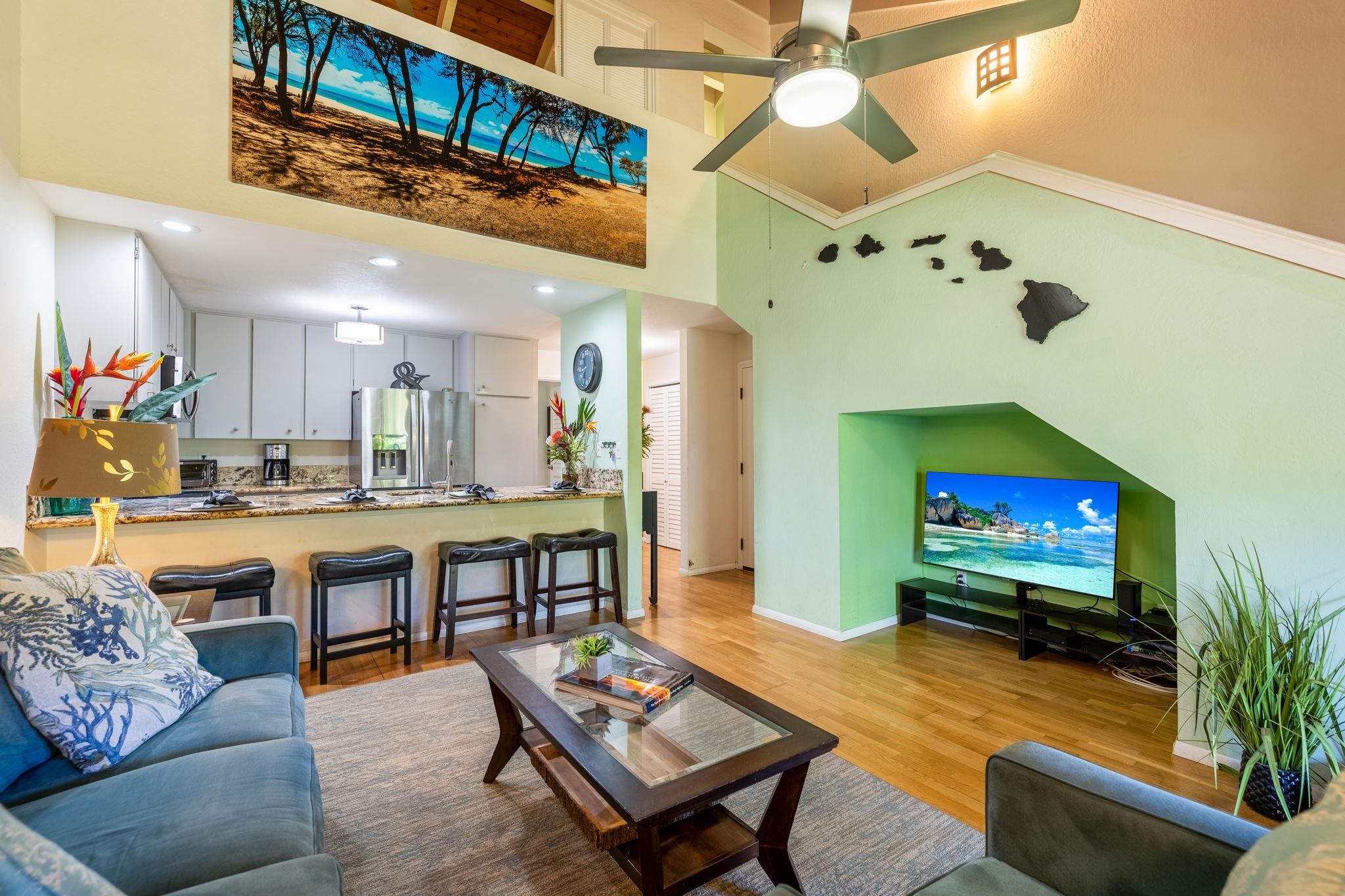 777 South Kihei Road, Unit 221G Kihei, HI 96753 - Photo 8 of 50 a living room with furniture and a flat screen tv