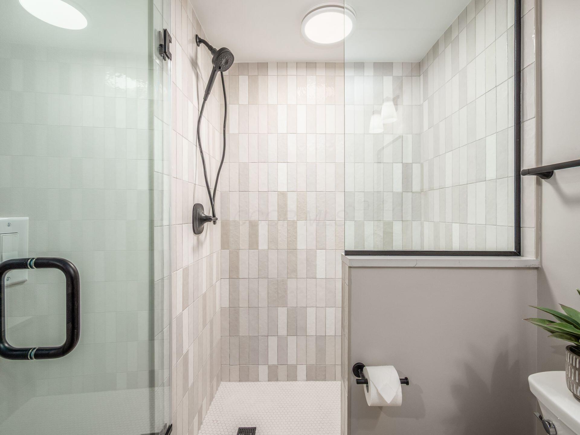 357 Tipperary Loop Delaware, OH 43015 - Photo 47 of 71 Walk-in shower with custom glass door and tile surround