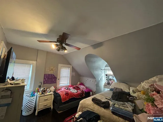 a bedroom with furniture and a chandelier