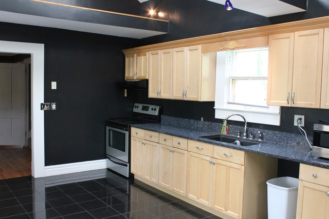 5249 Halley Road Rockford, IL 61101 - Photo 11 of 20 a kitchen with granite countertop white cabinets sink and window