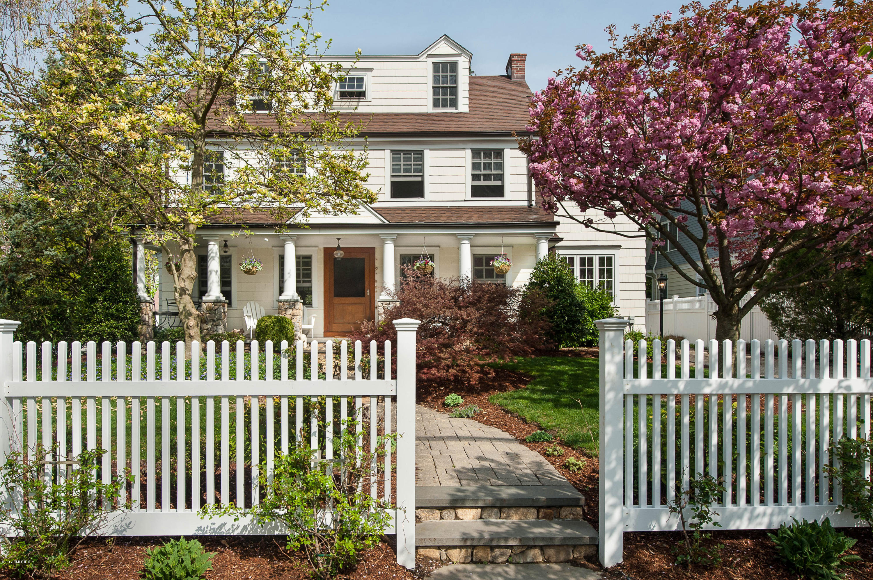7 Keofferam Road Old Greenwich, CT 06870 - Photo 1 of 27 a front view of a house with a garden