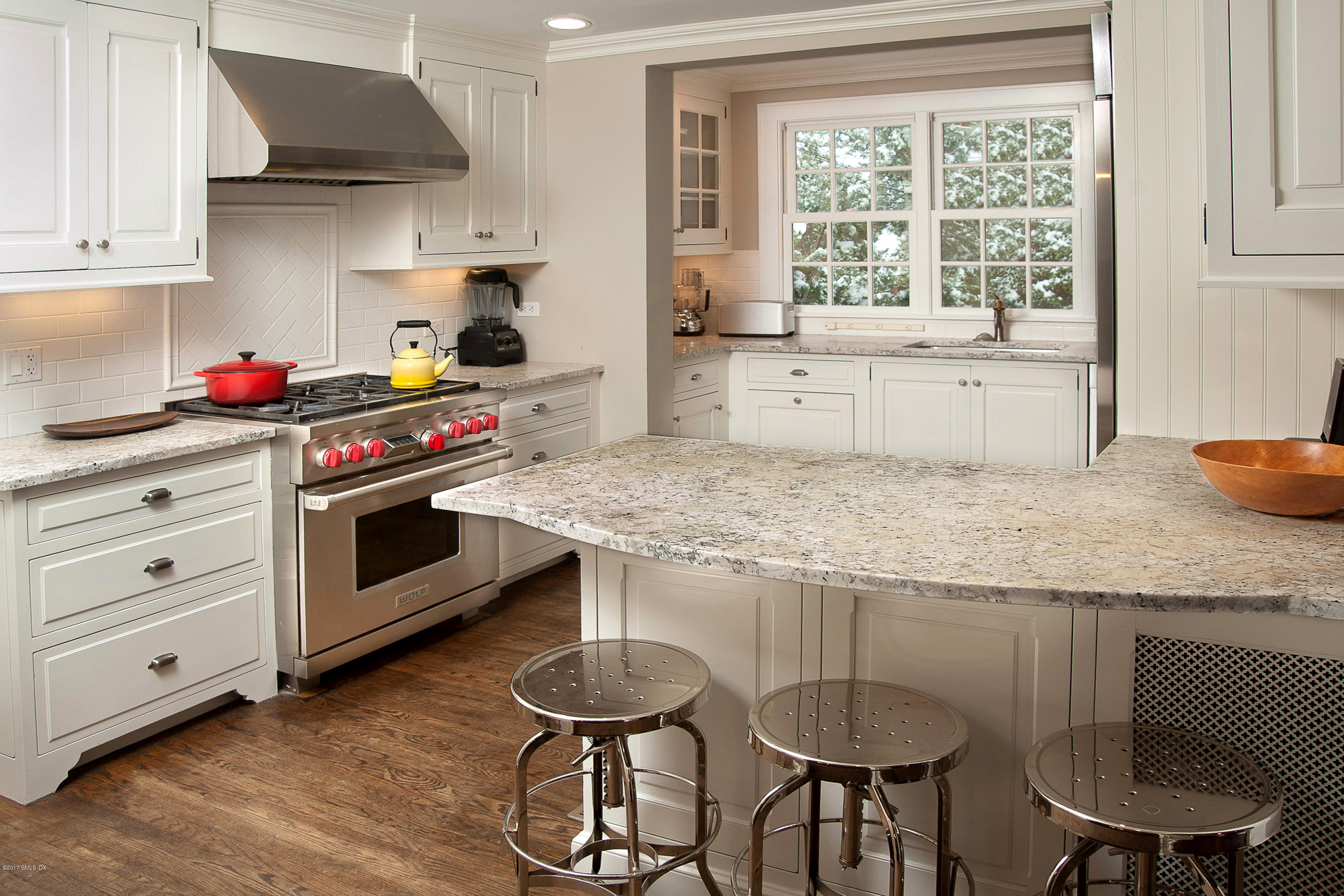 7 Keofferam Road Old Greenwich, CT 06870 - Photo 8 of 27 a kitchen with granite countertop a sink appliances and cabinets