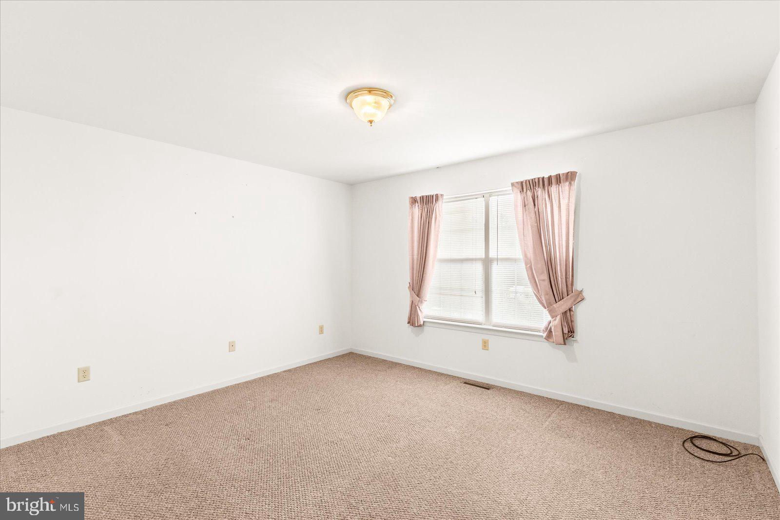 99 Furlong Way, Unit 99 Red Lion, PA 17356 - Photo 11 of 49 an empty room with a window