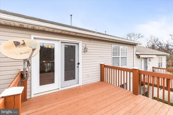 a view of a deck with a wooden fence