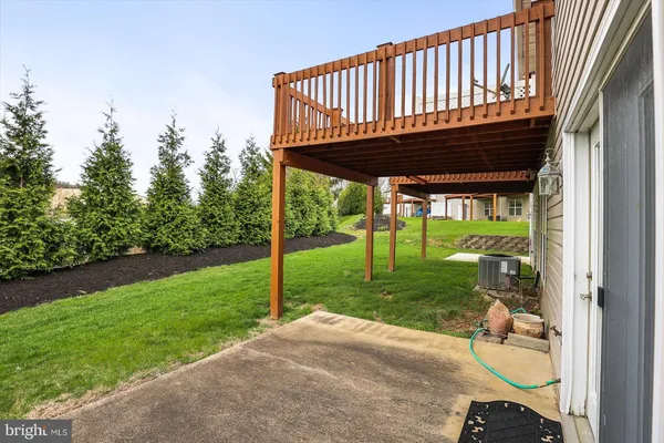 a view of a swimming pool with an outdoor seating