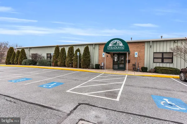 a view of a porch and a garage