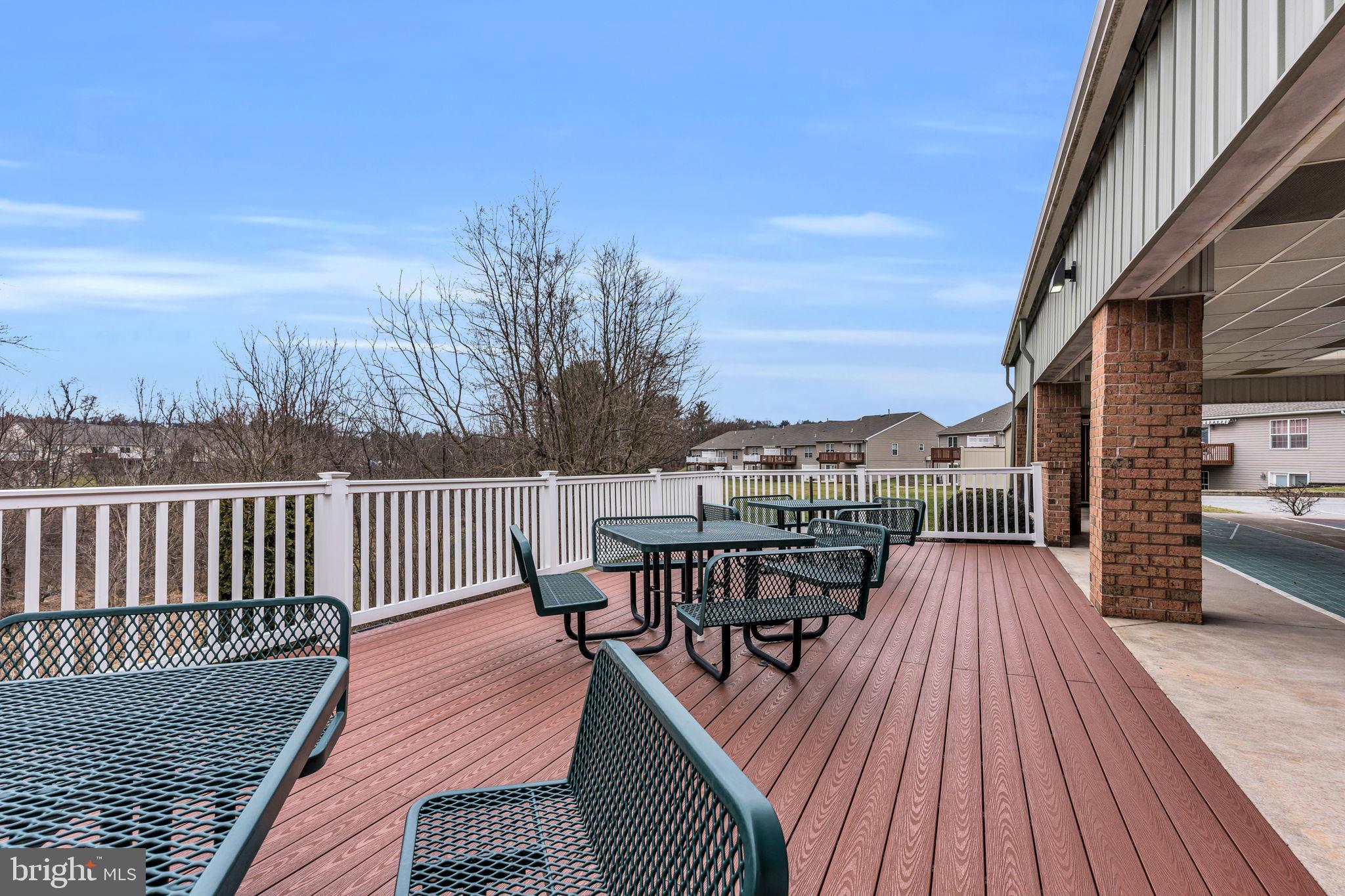 99 Furlong Way, Unit 99 Red Lion, PA 17356 - Photo 35 of 49 a view of a roof deck with table and chairs