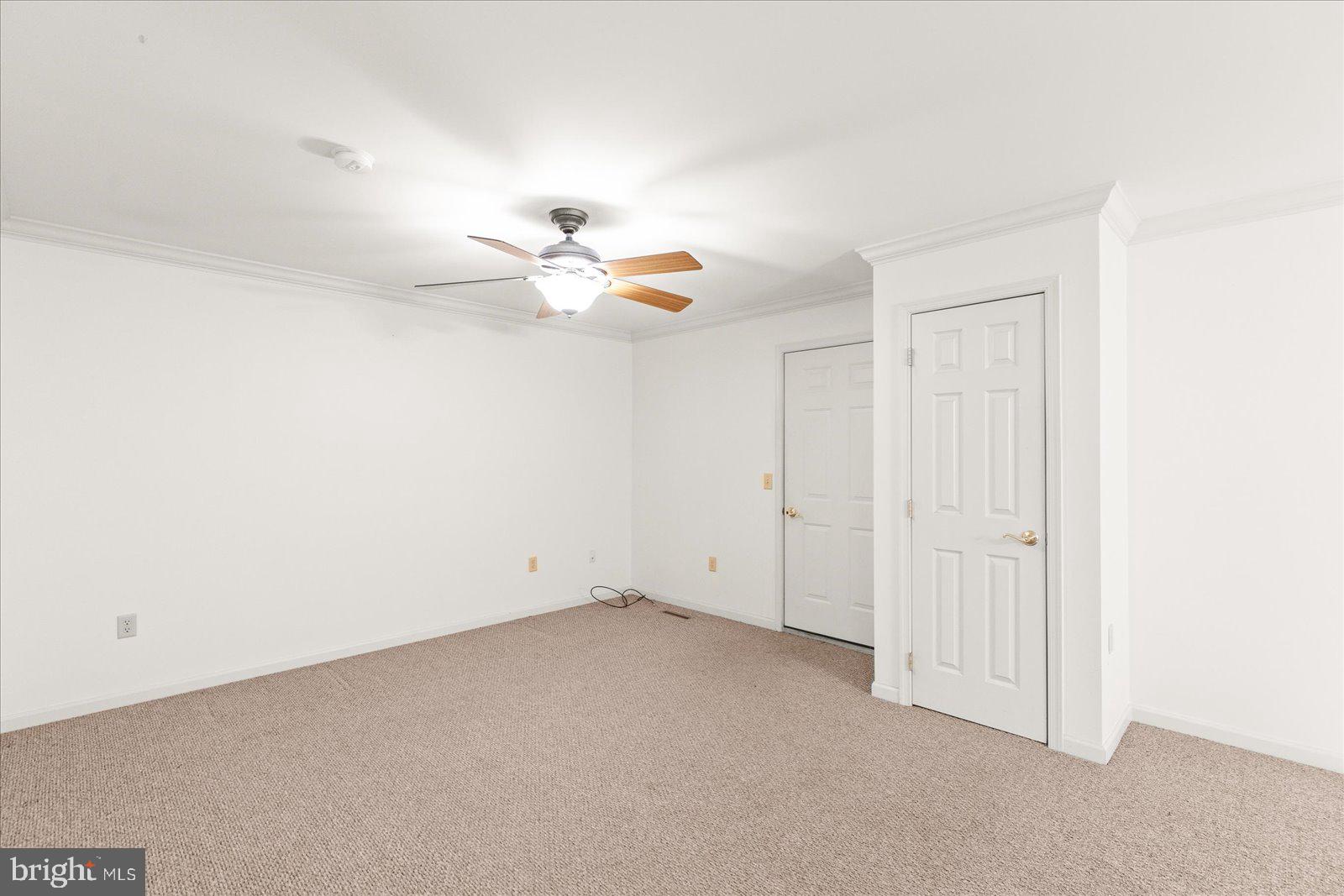 99 Furlong Way, Unit 99 Red Lion, PA 17356 - Photo 6 of 49 an empty room with a chandelier fan and windows