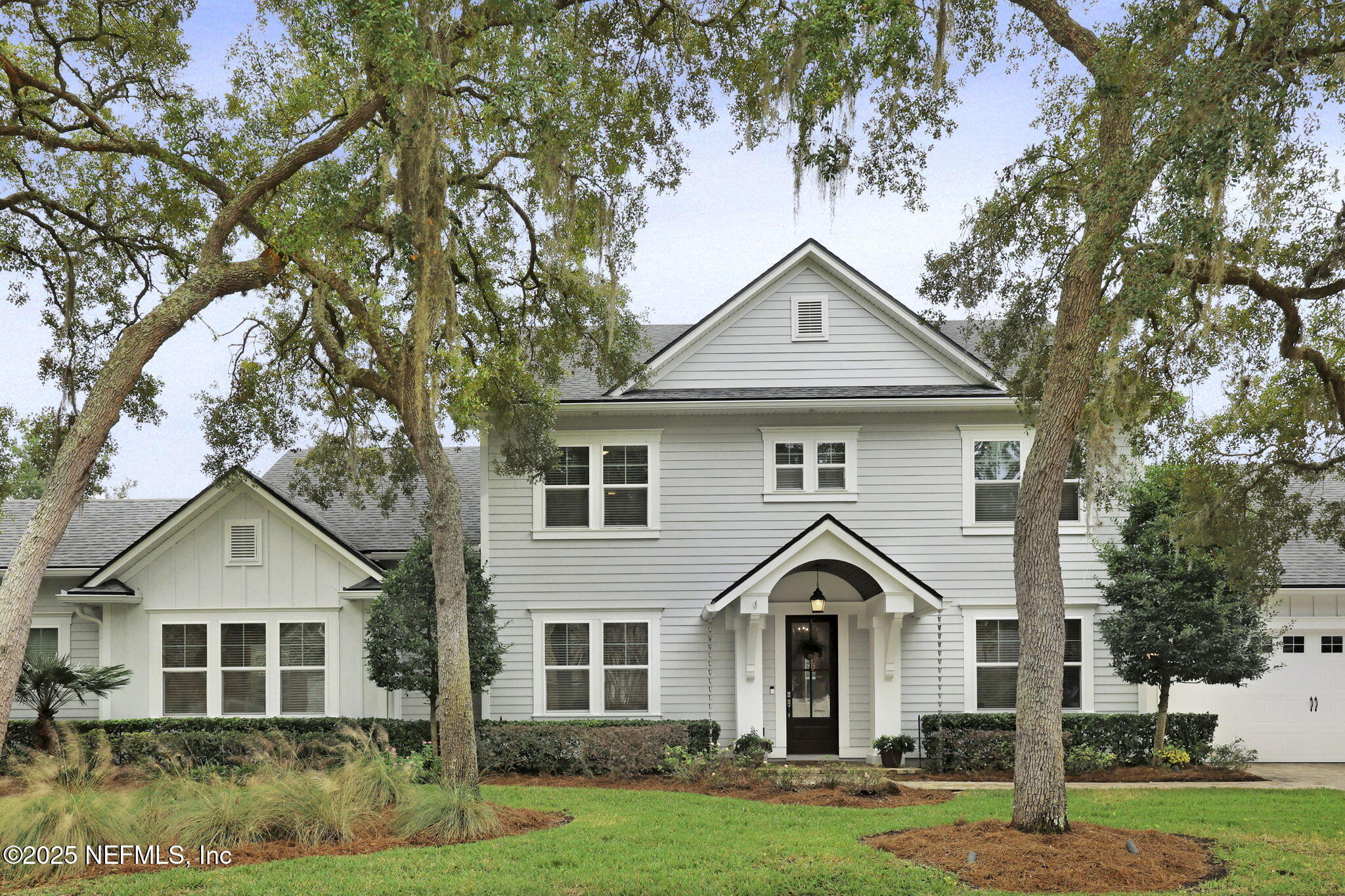 2624 Wrightson Drive Jacksonville, FL 32223 - Photo 2 of 52 a front view of a house with garden