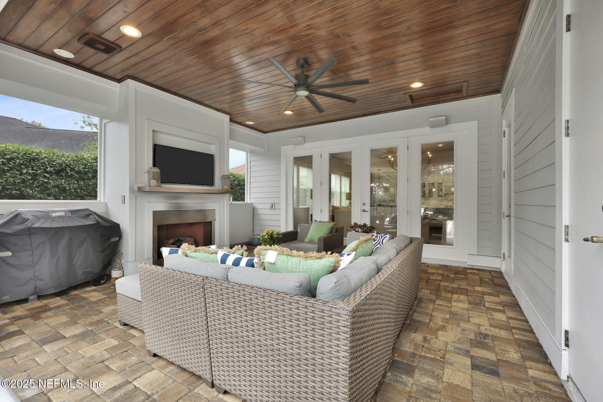 2624 Wrightson Drive Jacksonville, FL 32223 - Photo 23 of 52 a living room with furniture a fireplace and a flat screen tv