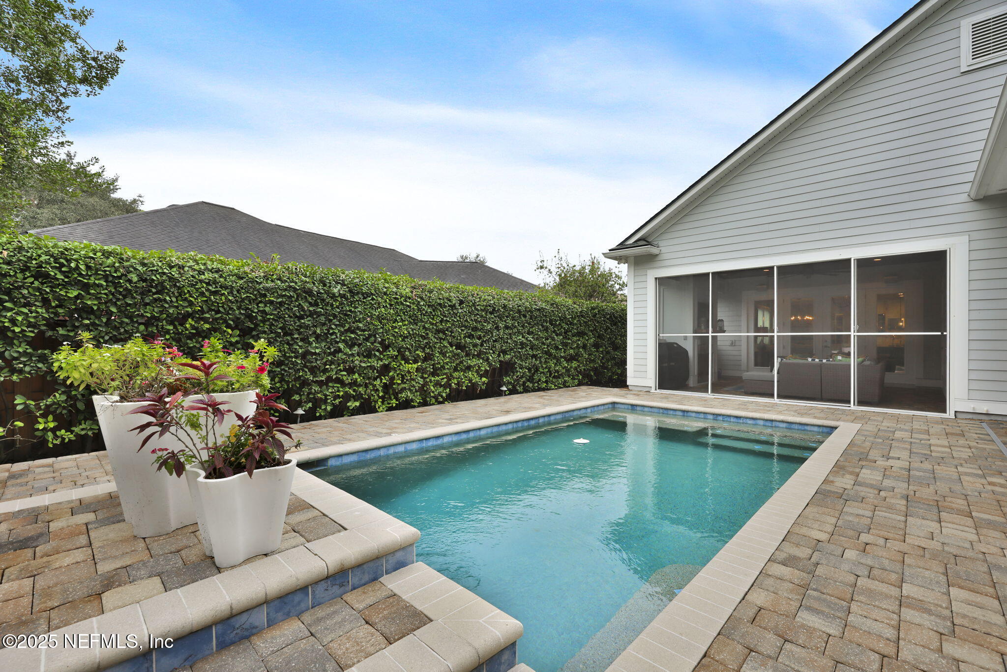 2624 Wrightson Drive Jacksonville, FL 32223 - Photo 27 of 52 a view of a swimming pool with a lounge chair