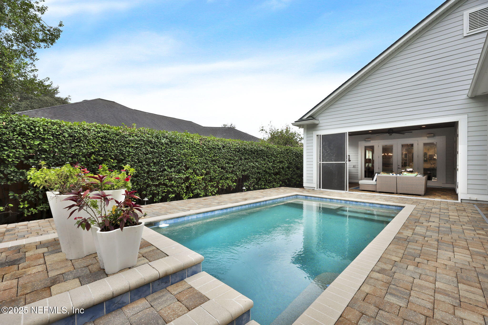 2624 Wrightson Drive Jacksonville, FL 32223 - Photo 28 of 52 a view of a swimming pool with a lounge chair