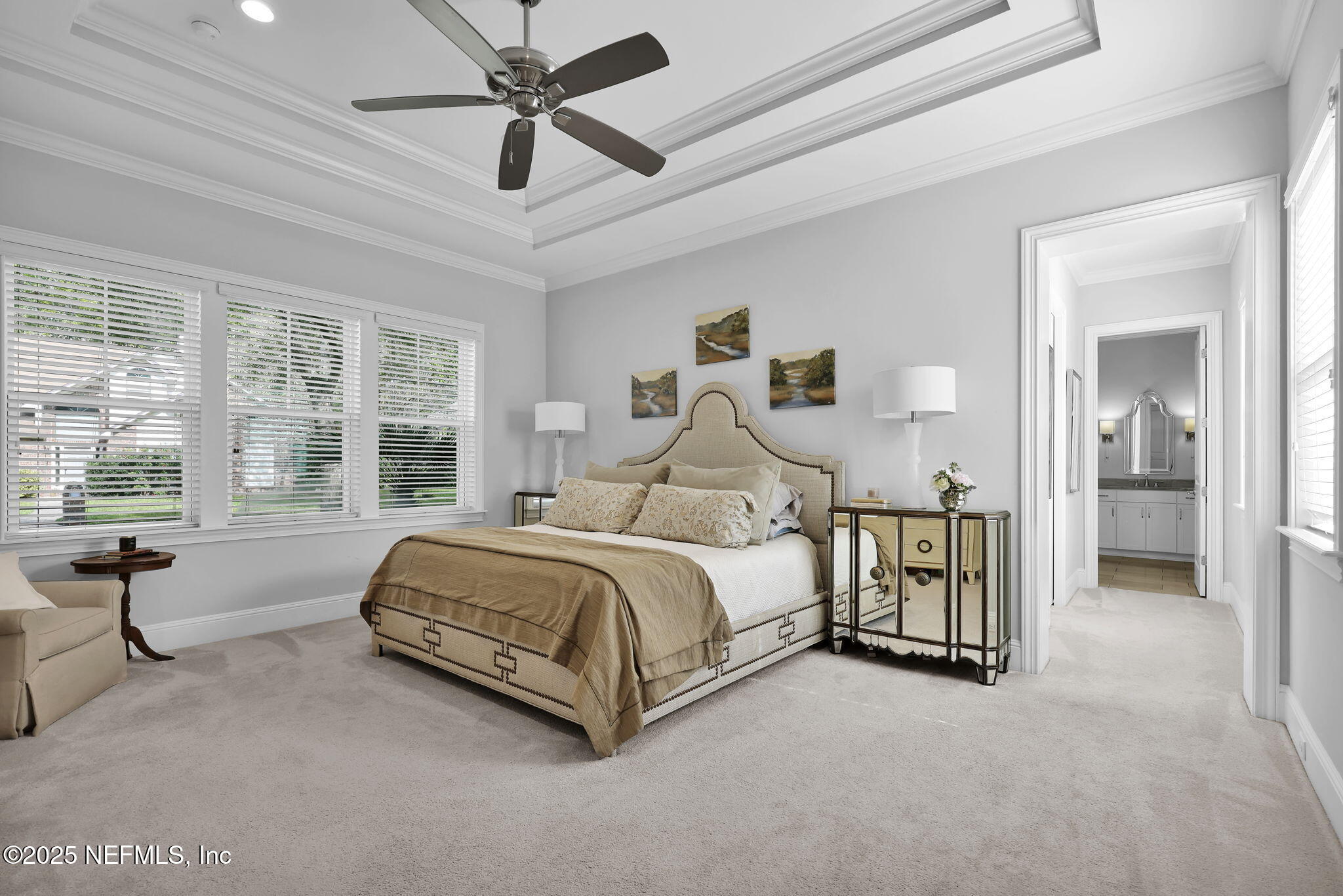 2624 Wrightson Drive Jacksonville, FL 32223 - Photo 30 of 52 a spacious bedroom with a bed and large windows