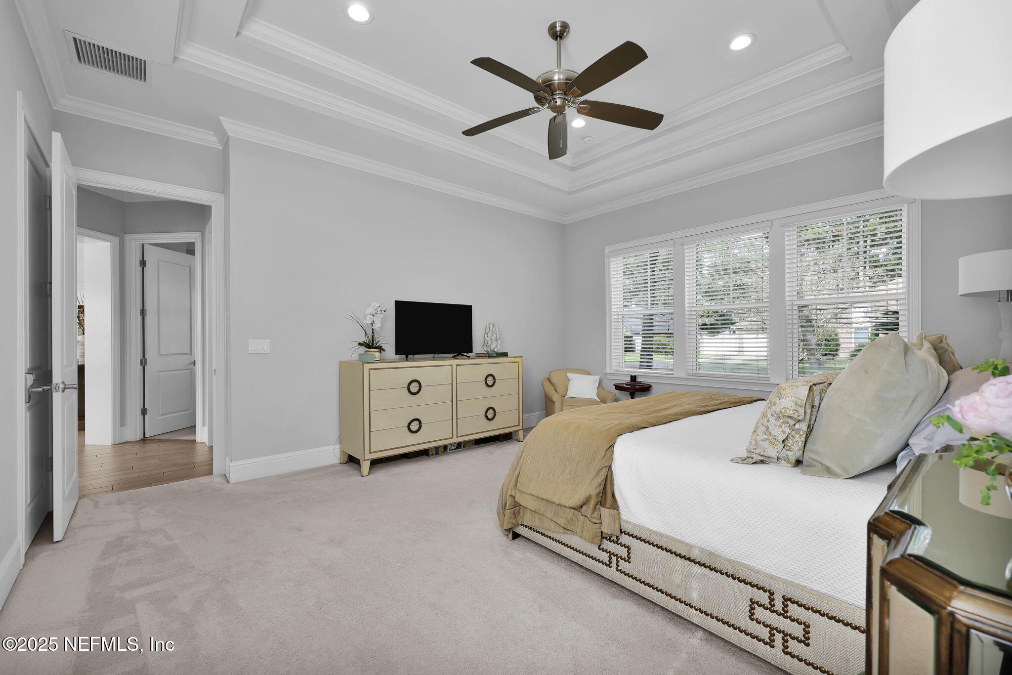2624 Wrightson Drive Jacksonville, FL 32223 - Photo 31 of 52 a bedroom with a bed and a tv