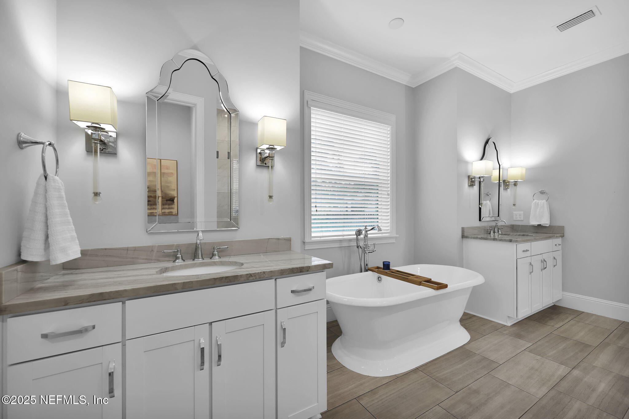 2624 Wrightson Drive Jacksonville, FL 32223 - Photo 36 of 52 a bathroom with a double vanity sink a toilet and a mirror