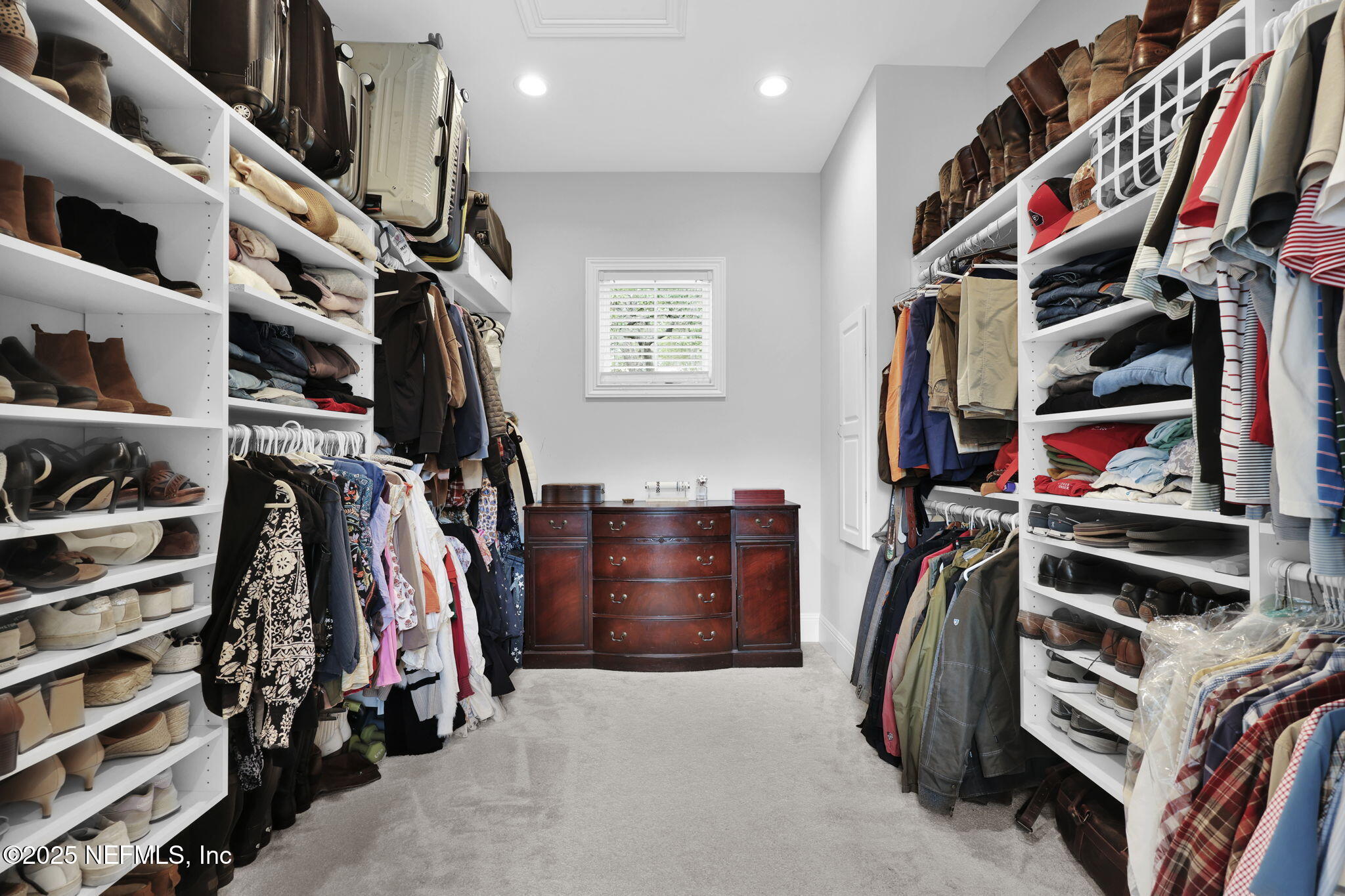 2624 Wrightson Drive Jacksonville, FL 32223 - Photo 37 of 52 a view of walk in closet with clothes and shoes