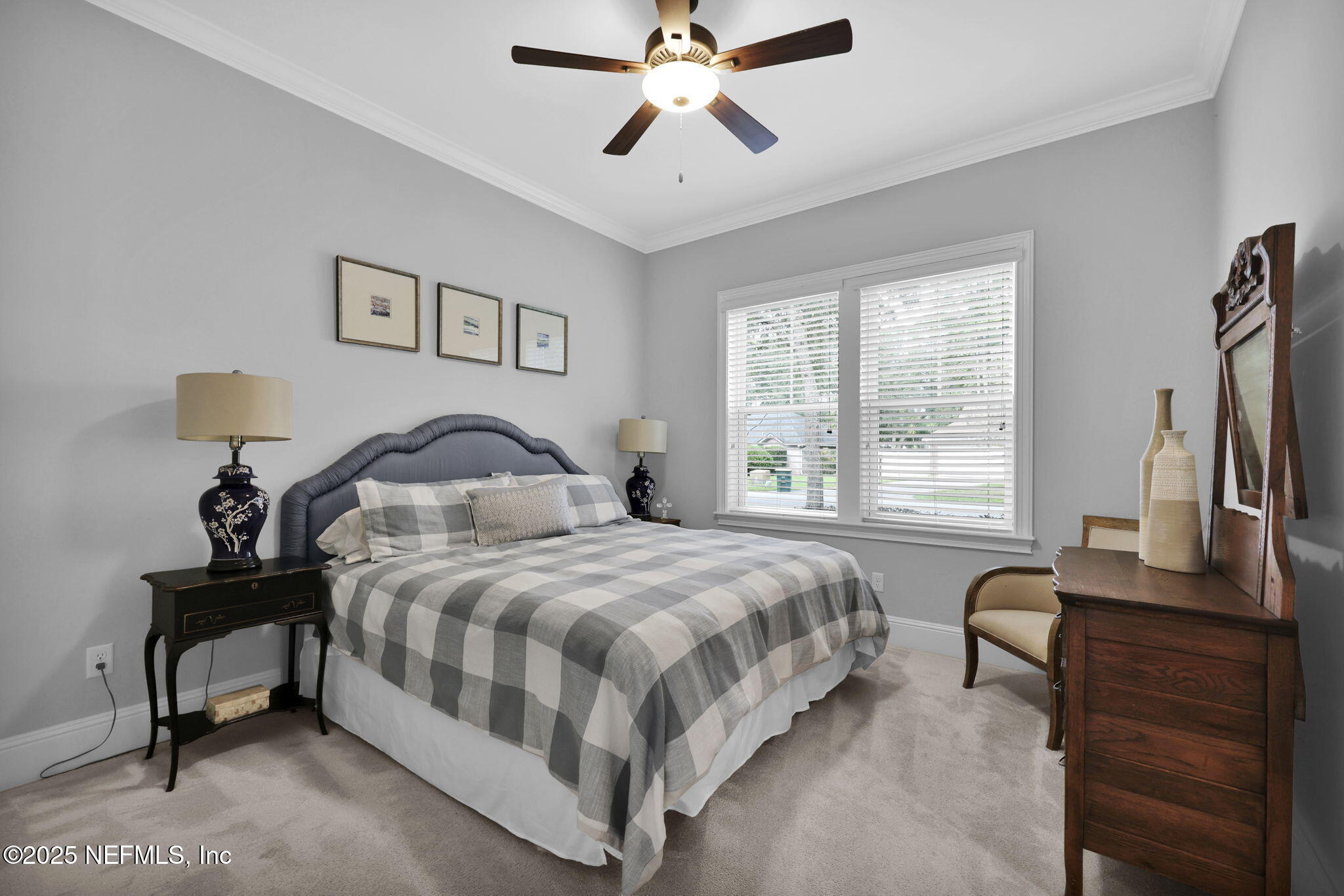 2624 Wrightson Drive Jacksonville, FL 32223 - Photo 38 of 52 a bedroom with a bed and a flat screen tv