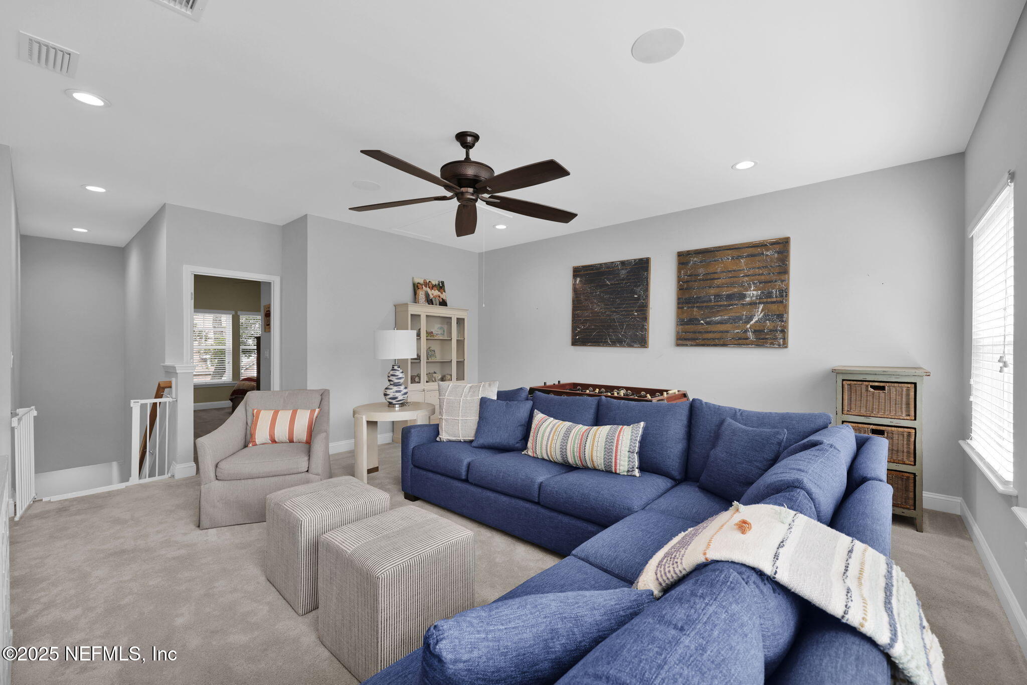 2624 Wrightson Drive Jacksonville, FL 32223 - Photo 43 of 52 a living room with furniture ceiling fan and a rug