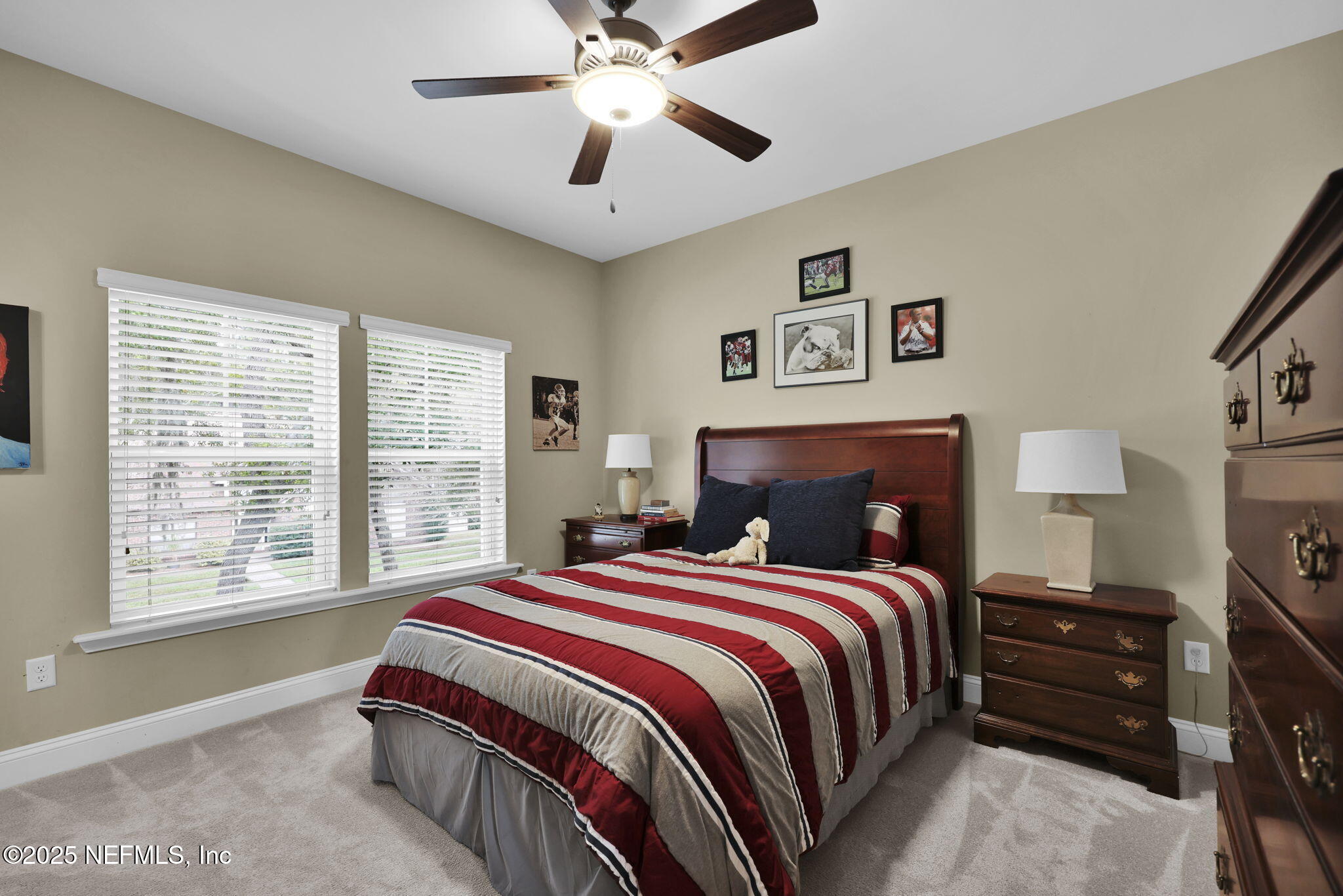 2624 Wrightson Drive Jacksonville, FL 32223 - Photo 44 of 52 a bedroom with a bed and a chandelier
