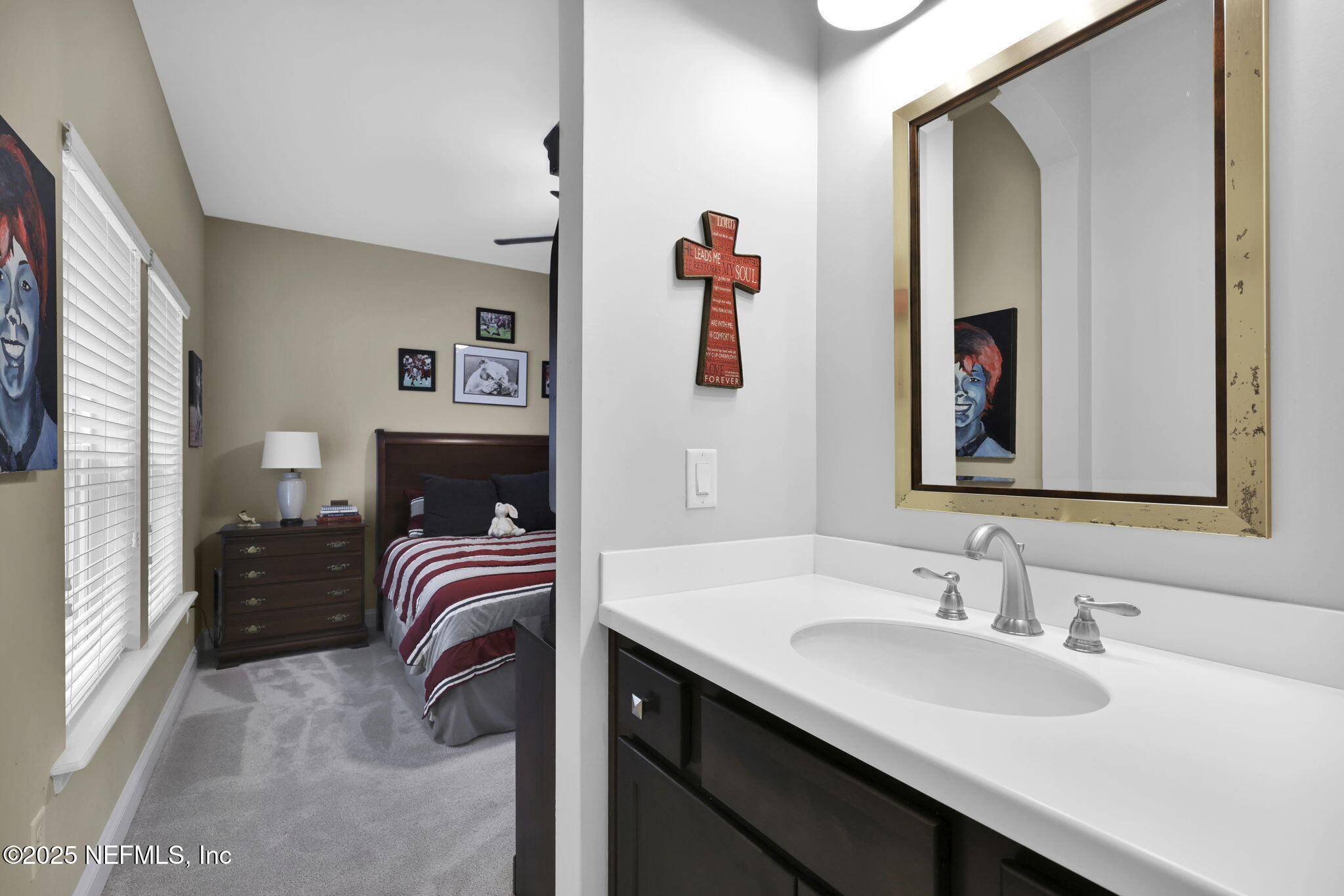 2624 Wrightson Drive Jacksonville, FL 32223 - Photo 45 of 52 a en suite bathroom with a sink double vanity and a mirror