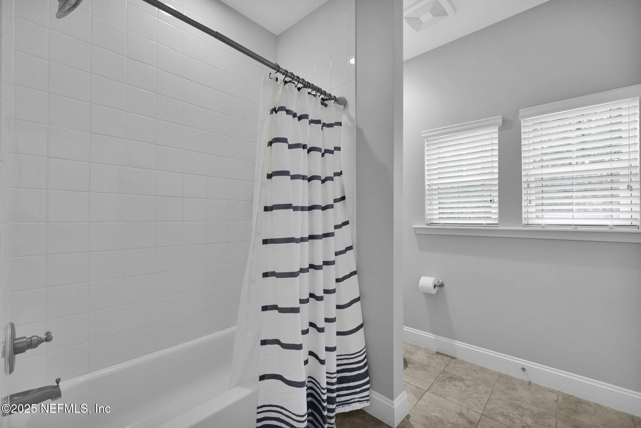 2624 Wrightson Drive Jacksonville, FL 32223 - Photo 46 of 52 a bathroom with a bathtub and shower
