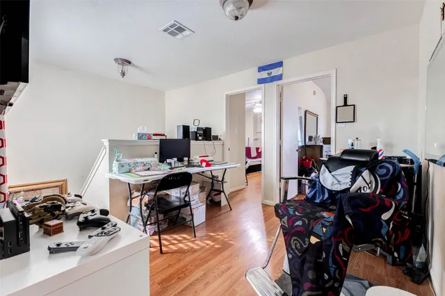 a view of a workspace with furniture and toys
