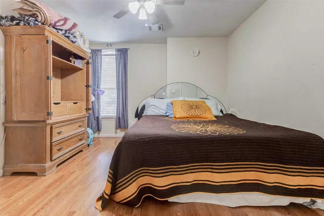 a bedroom with a bed and a closet