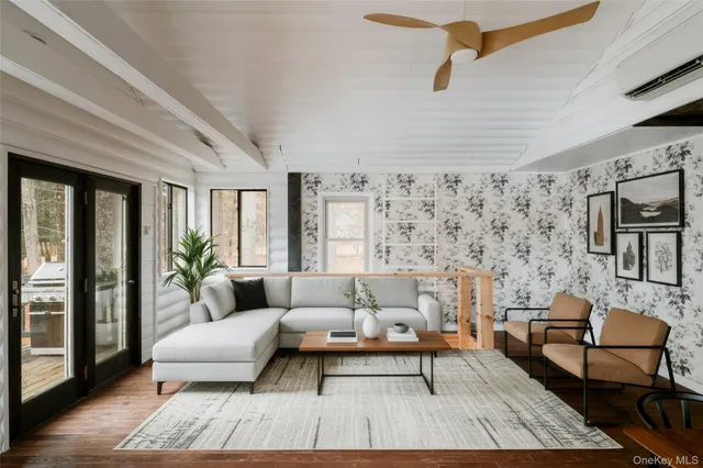 a living room with furniture and a rug