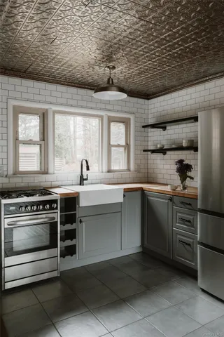 a kitchen with a stove and a sink